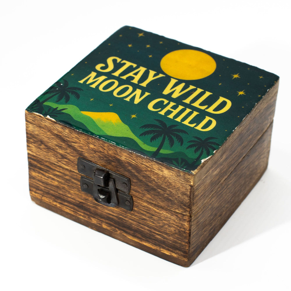 Wooden box with 'Stay Wild Moon Child' text and nature-themed design on a white background