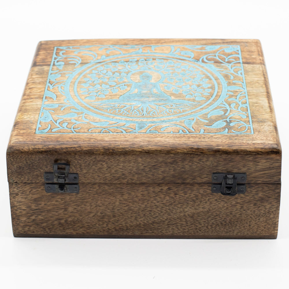 Wooden box with decorative blue pattern on a white background