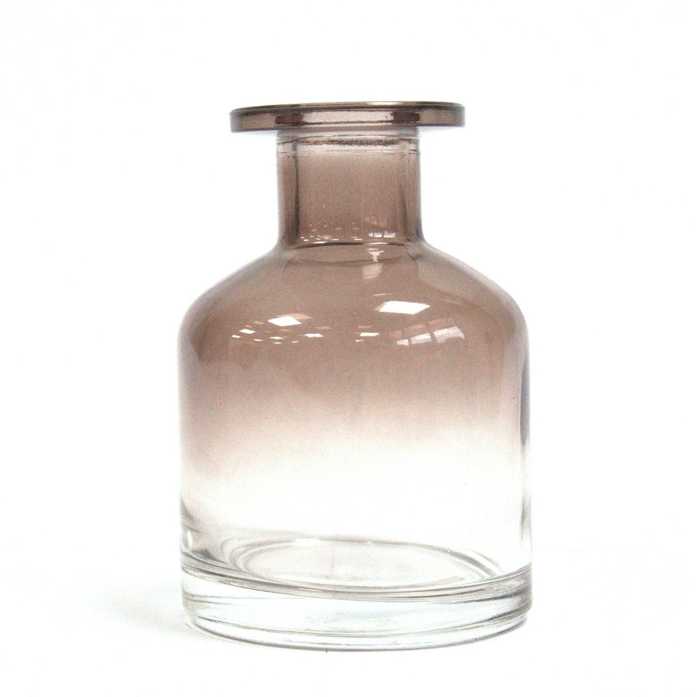 Clear glass vase with gradient color on a white background