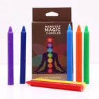 Set of colorful candles with a 'Manifest Magic Candles' packaging featuring seven chakra symbols.