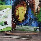 Aromatherapy basil incense packaging with incense sticks on a wooden surface.