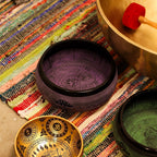 Decorative bowls with intricate designs on a colorful textured surface