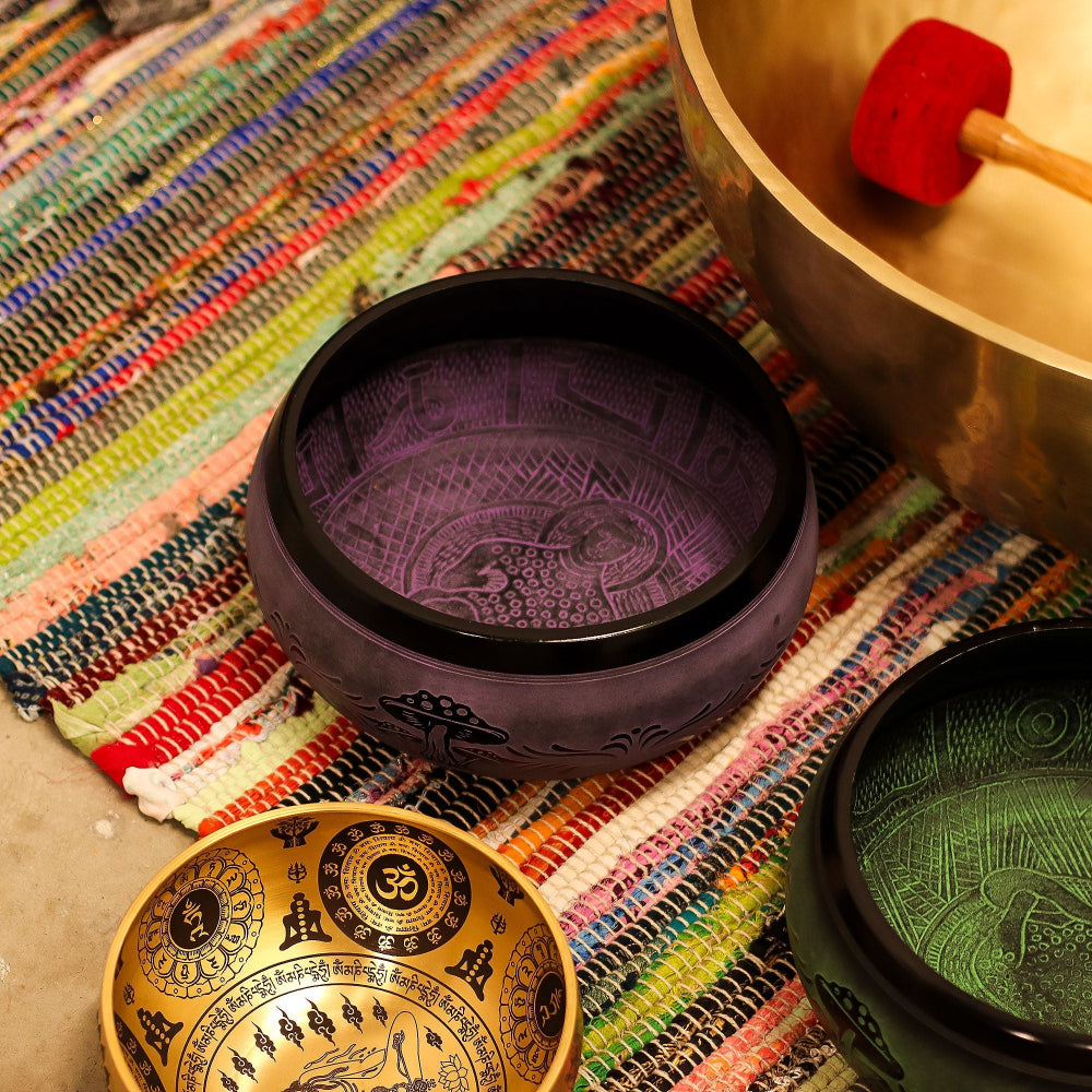 Decorative bowls with intricate designs on a colorful textured surface