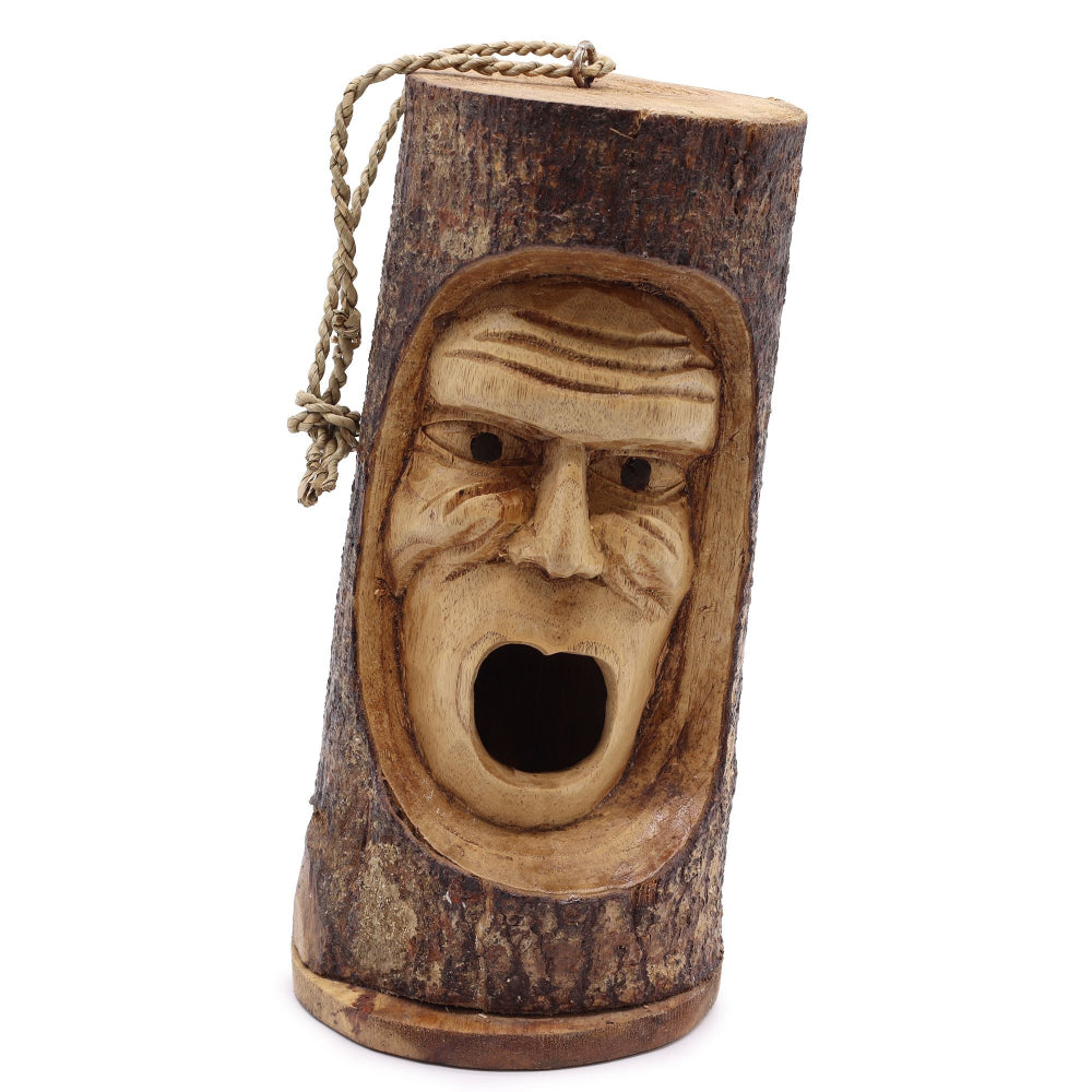 Wooden birdhouse shaped like a face with a mouth on a white background
