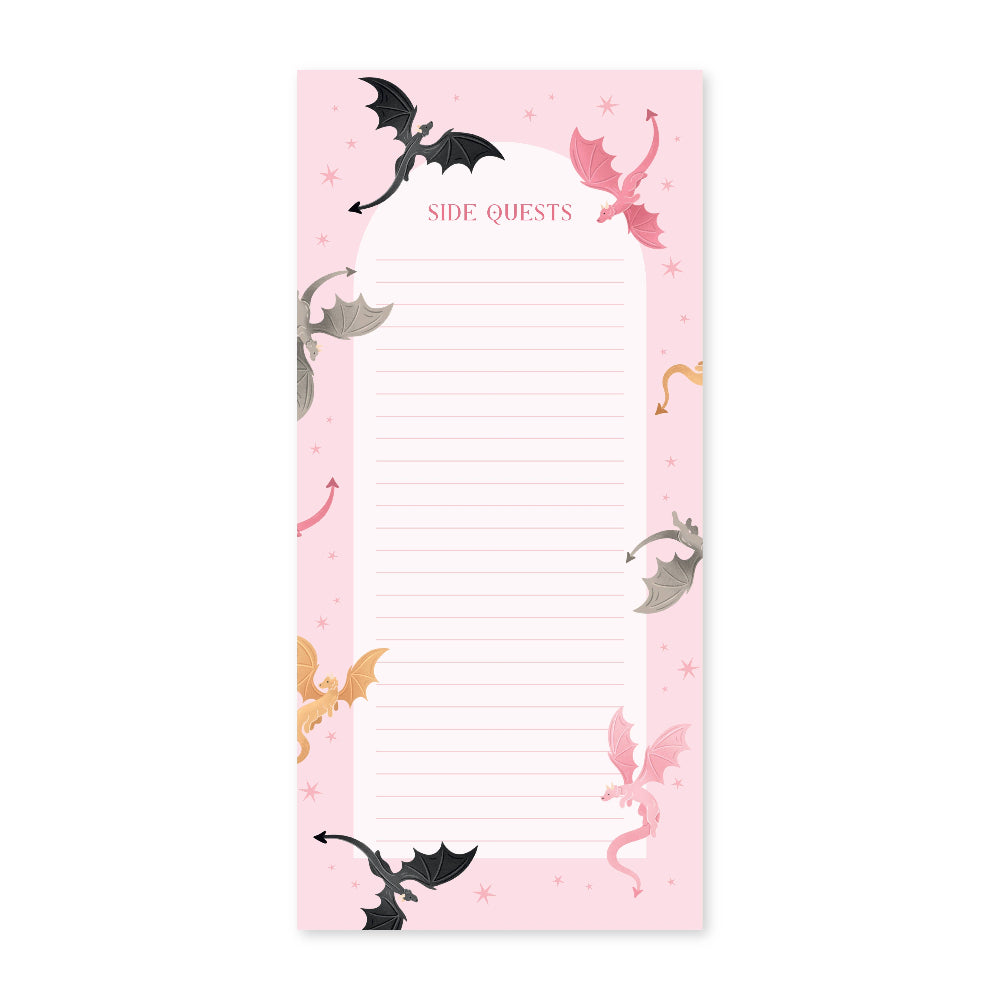 Notepad with dragon illustrations on a pink background