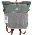 Green and gray patterned backpack with brown straps on a white background