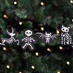 Eleanoras Set of 4 Black Creepy Skeleton Cookie Ornaments 